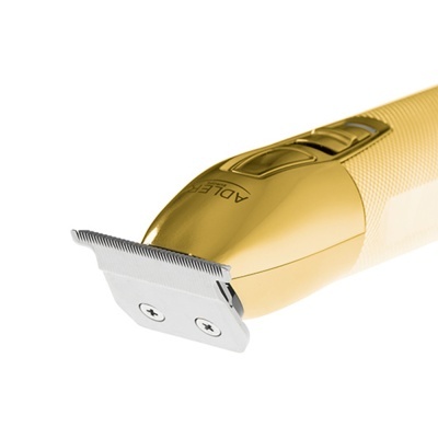 aparelho de barbear elétrico dourado com lâmina metálica