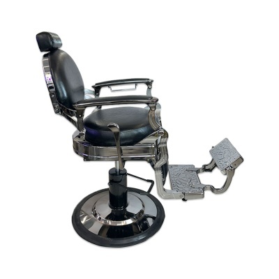 Cadeira de barbeiro vintage preta com base metálica redonda e apoios para pés