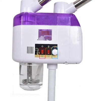Aparelho elétrico branco e roxo para vapor facial com botões e recipiente transparente