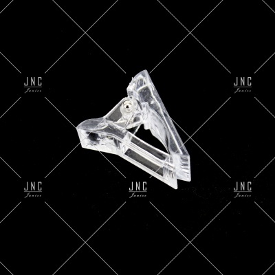 Clipe transparente de plástico com mola metálica