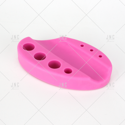 Base suporte em silicone rosa com orifícios para ferramentas
