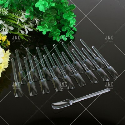 Conjunto de 12 espátulas plásticas transparentes com plantas ao fundo