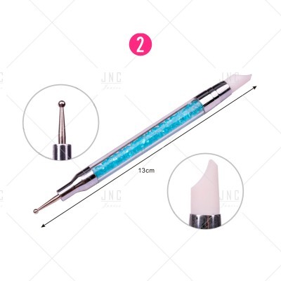 Ferramenta dupla para unhas com pedras azuis no cabo e pontas metálica e silicone