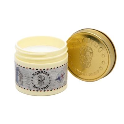 Frasco creme branco com tampa dourada e rótulo com texto e desenho de homem de barba