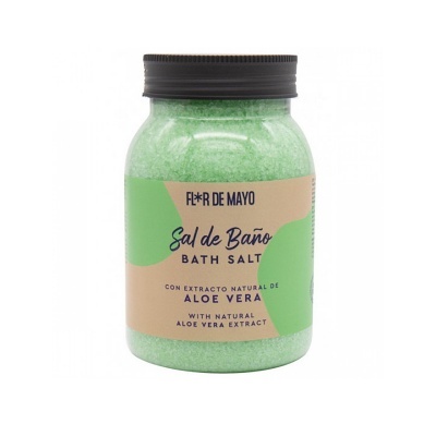 Frasco de sais de banho verde com rótulo bege e verde e tampa preta.