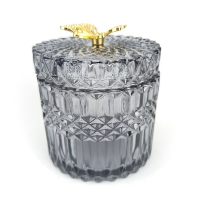 Frasco decorativo de vidro azul cinzento com tampa e puxador dourado em forma de folha