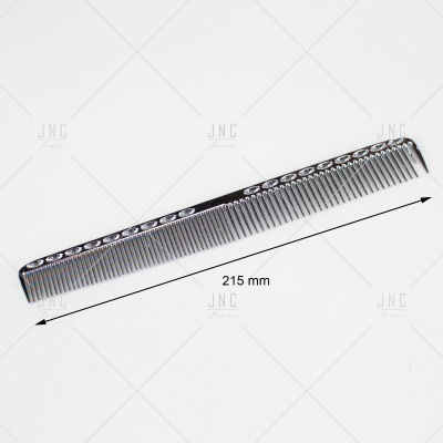 Pente de cabelo preto com padrão decorativo sobre fundo branco