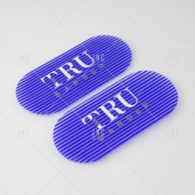 Pads ovais azuis para barbear com texto 'TRU BARBER'