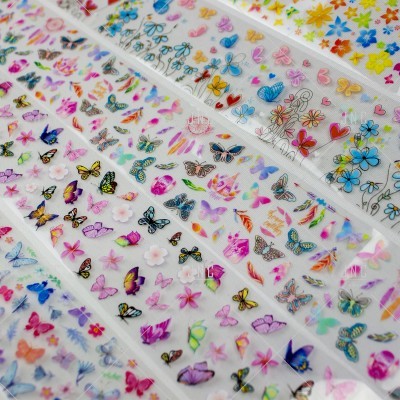 folhas de autocolantes com borboletas e flores coloridas