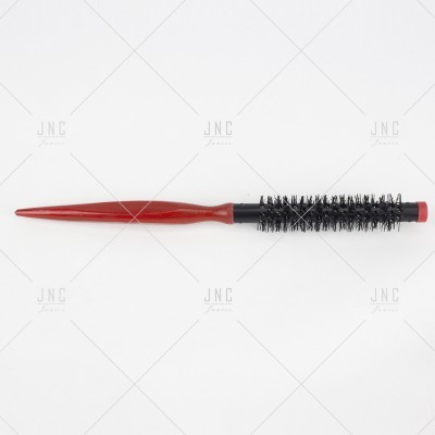 Escova de cabelo redonda com cabo vermelho e cerdas pretas