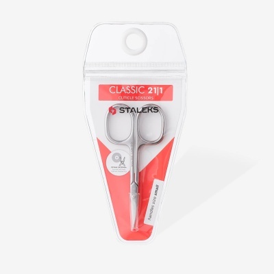 Tesouras para cutículas metálicas da marca STALEKS em embalagem transparente com fundo vermelho