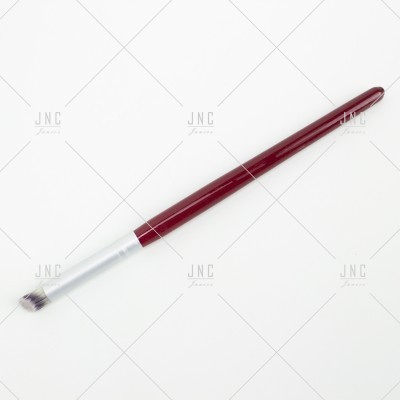 Pincel de maquilhagem vermelho com cerdas bicolores
