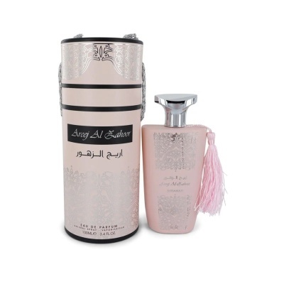 Frasco de perfume rosa claro com embalagem cilíndrica decorativa rosa e prateada