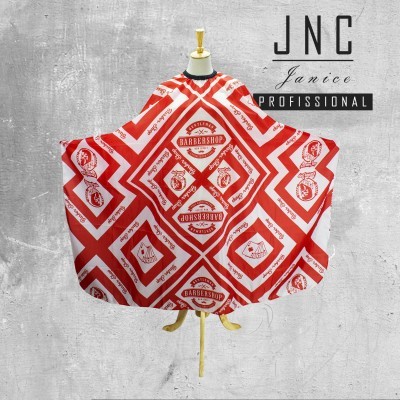 Capa de barbeiro branca e vermelha com padrões geométricos e texto em manequim