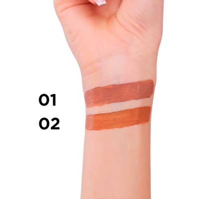 Amostras de maquilhagem castanhas em braço claro com números 01 e 02 ao lado.