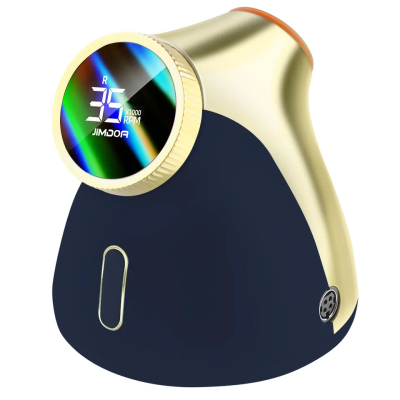 Dispositivo preto e dourado com ecrã digital circular e botão retangular