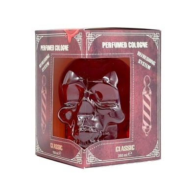 Frasco de colónia perfumada em forma de caveira vermelha dentro de caixa de cartão vermelha com texto branco