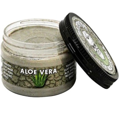 Pote de máscara de argila Aloe Vera aberto com tampa preta ao lado