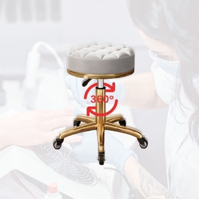 Banco giratório estofado cinza com base dourada e rodízios pretos