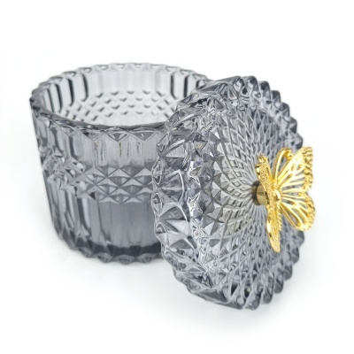 Frasco de vidro transparente com tampa e puxador dourado