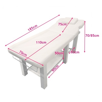 Cama de massagem branca com medidas em centímetros indicadas em rosa