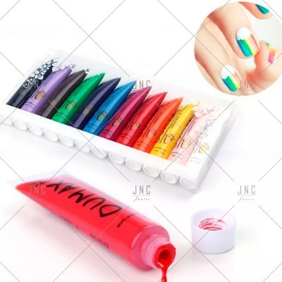 Tubos de tinta colorida para unhas em caixa transparente com tampa branca e unhas pintadas multicoloridas