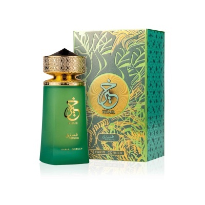 Frasco de perfume verde com tampa dourada e caixa decorada em verde e amarelo.