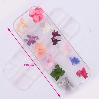 Saco plástico transparente com pétalas de flores coloridas separadas e medição de 130mm