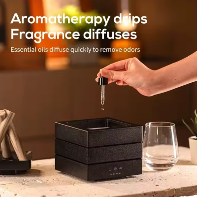 Difusor de aromas preto quadrado com conta-gotas e copo de vidro ao lado