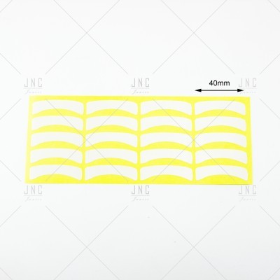Adesivos amarelos para sobrancelhas em cartão branco com medida de 40 mm