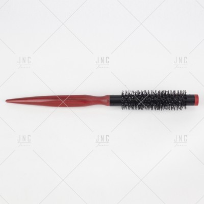 Escova de cabelo redonda com cabo vermelho e cerdas pretas