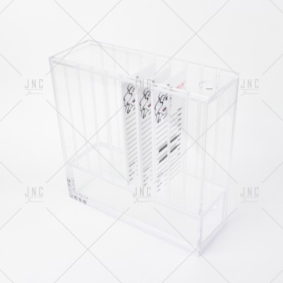 Organizador acrílico transparente com divisórias e caixas pequenas com desenhos de rosto