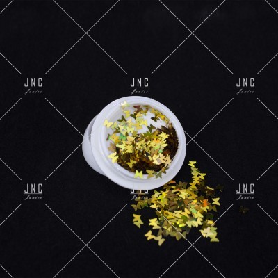 Pote branco com glitter de borboletas douradas e amarelas em superfície preta