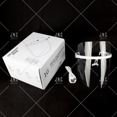 Máscara facial transparente com suporte branco e caixa branca