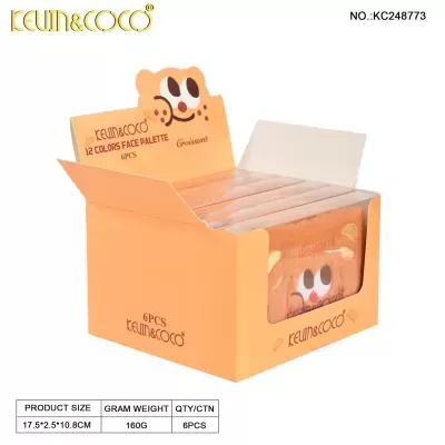 Caixa aberta laranja com paletes de maquilhagem Keum&Coco e desenho carinha sorridente