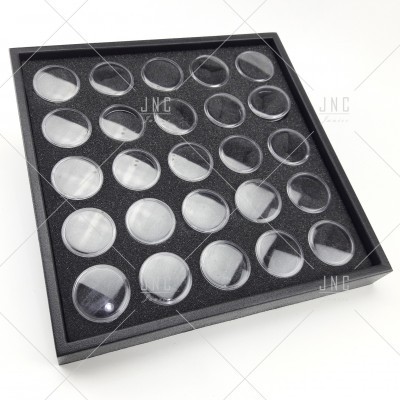 Tabuleiro preto com 30 bolhas de plástico transparente organizadas em grelha