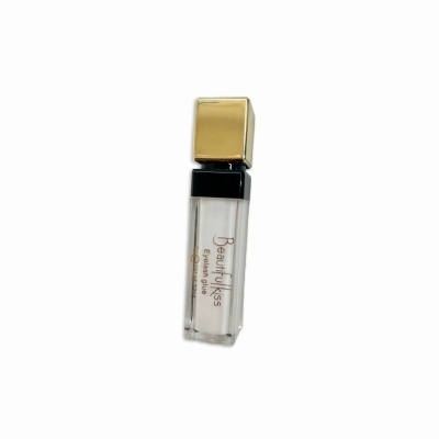 Frasco transparente com tampa dourada e texto Beauty Kiss Eyelash glue