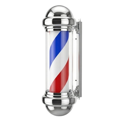 Poste de barbeiro cromado com fita espiral azul, branca e vermelha, montado na parede.