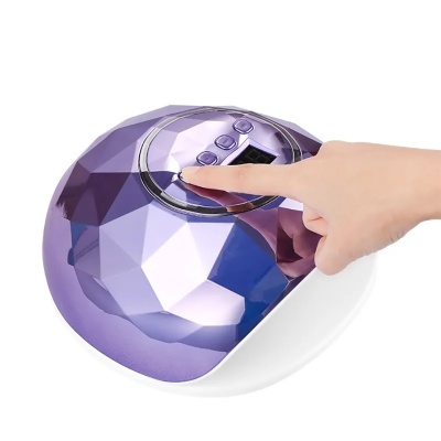 Dispositivo tecnológico roxo com botões e ecrã digital