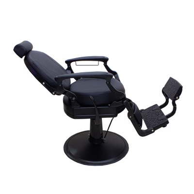Cadeira de barbeiro reclinável preta com apoio de pés e base redonda.