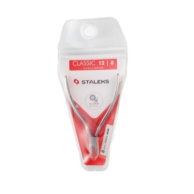 Alicate para cutículas STALEX em embalagem plástica transparente com fundo vermelho