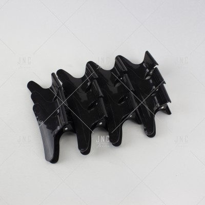 Clipe de cabelo preto plástico com design ondulado