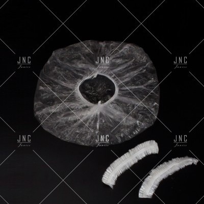 Touca descartável de plástico transparente com elásticos brancos ao lado