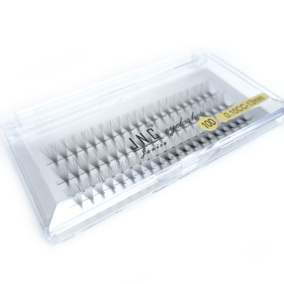 Conjunto de pestanas falsas individuais numa caixa transparente com texto