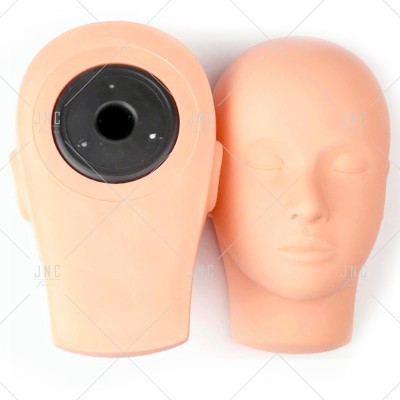 Duas cabeças de manequim cor de pele, uma com rosto e outra com abertura circular preta atrás.