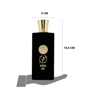 frasco de perfume preto com tampa dourada e texto dourado AJWAA OUD