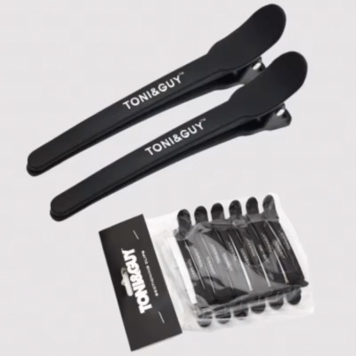 Conjunto de presilhas de cabelo pretas TONI&GUY com embalagem.