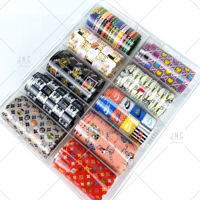 Conjunto de rolos de papel de transferência para unhas com padrões coloridos e caixa transparente