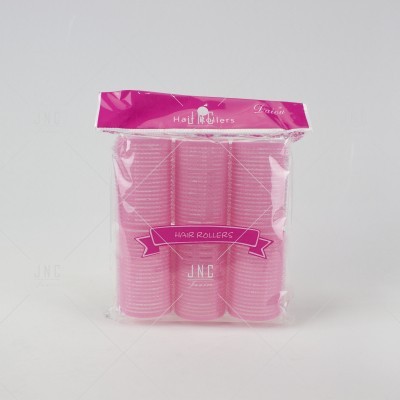 Conjunto de seis rolos de cabelo rosa em embalagem plástica transparente