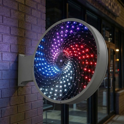 Painel circular de LED colorido fixado em parede de tijolos junto a porta de vidro